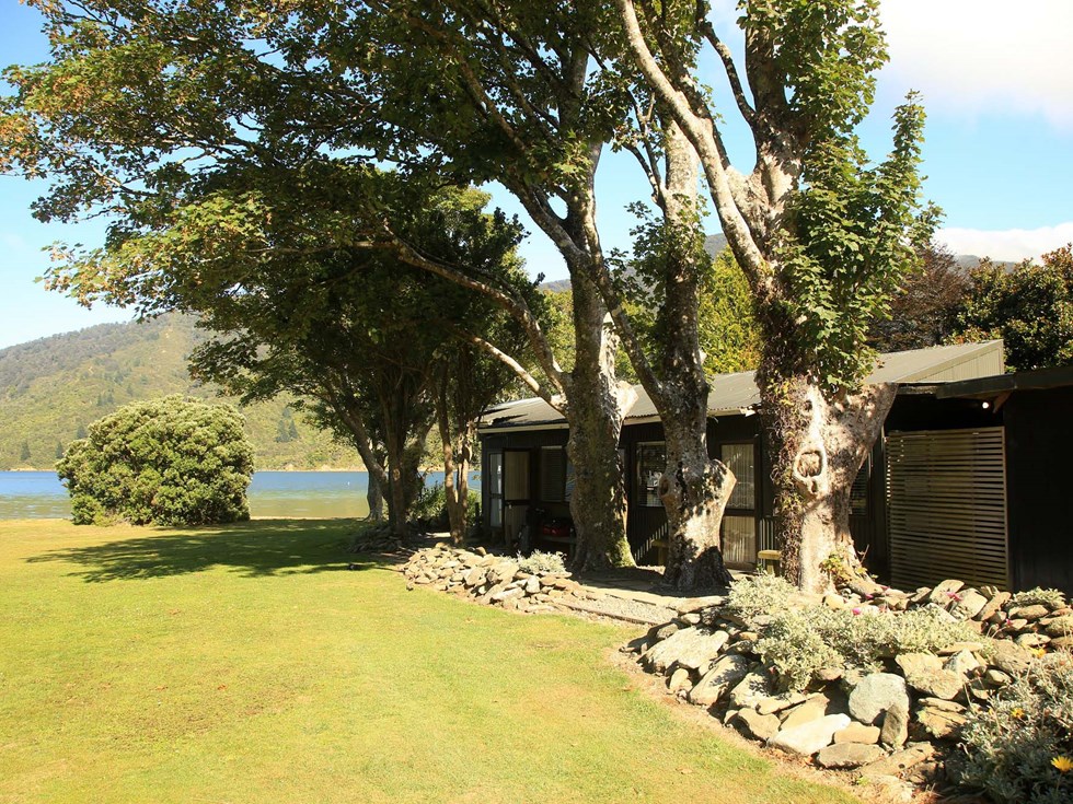 Hiker's cabins are close to the beach and provide excellent ocean views at Furneaux Lodge in the Marlborough Sounds at the top of New Zealand's South Island.
