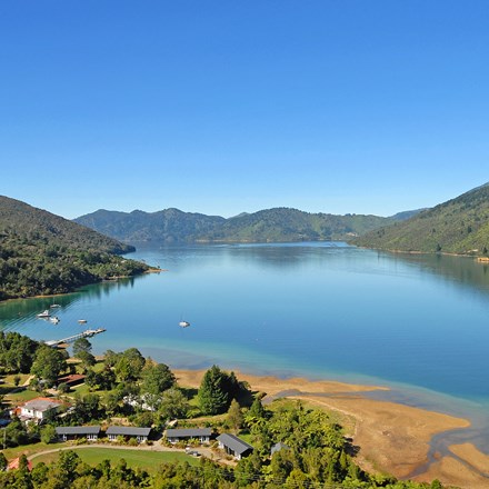 Aerial view of Furneaux Lodge out over Endeavour Inlet in the Marlborough Sounds at the top of New Zealand's South Island.