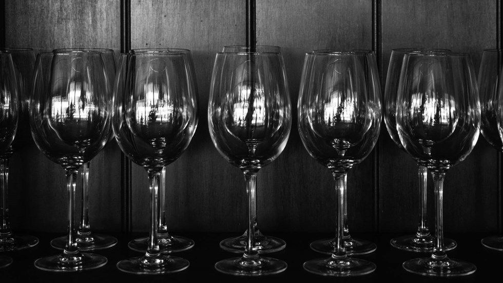 Rows of wine glasses on a shelf at the Furneaux Lodge Restaurant in the Marlborough Sounds at the top of New Zealand's South Island.