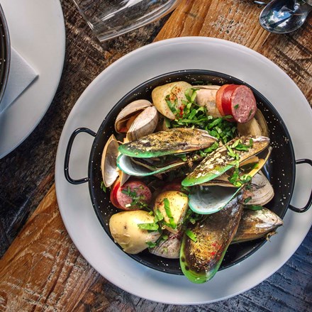 A bowl of freshly steamed mussel as a sharing plate option at the Furneaux Lodge Restaurant in the Marlborough Sounds at the top of New Zealand's South Island.